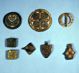 Top to Bottom: Early Medieval decorative discs and heraldic brooch; Square Viking age brooches and a stirrup mount