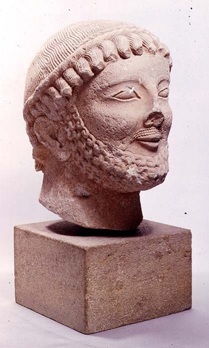 Cypro-Archaic head of a bearded male votary, 6th century BC (limestone)