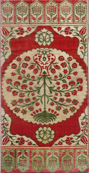 Red velvet cushion cover with embroidered pattern in gold and silver thread and green velvet