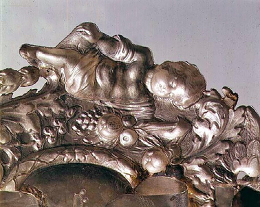 Example of Repousse work on a wall sconce of 1687