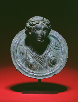 Gallo-Roman repousse applique roundel with the bust of a female, 2nd-3rd century AD (bronze)