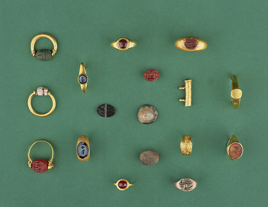 Collection of Roman, Etruscan and Hellenistic Jewellery including a Phoenician scarab ring, a cameo, amulet holders and an agate intaglio, ranging from the 6th century BC to the 4th AD