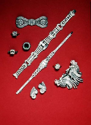 Selection of diamond jewellery; Edwardian bow- shaped brooch; double clip brooch; brilliant cut bracelet; cocktail watch; Edwardian square cut emerald ring