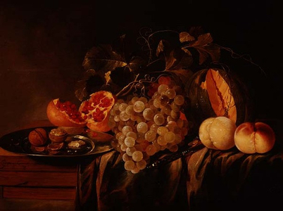 Still life of melon, grapes, pomegranate, walnuts on a pewter plate and peaches