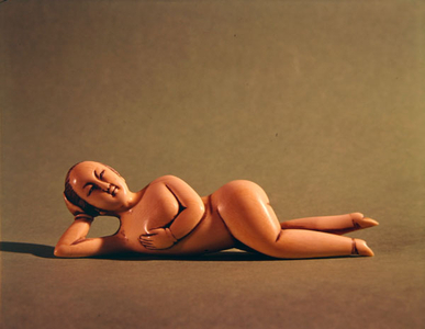 Figurine of woman used by sick patient to show doctor the affected area (ivory)