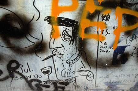 Cartoon of Serge Gainsbourg by a fan on the facade of his mansion, rue de Verneuil in the 7th arrondissement of Paris.