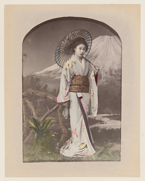 Girl in front of a painted decor of Mount Fuji - Girl - Japan 1880-1910 - Hand coloured photo