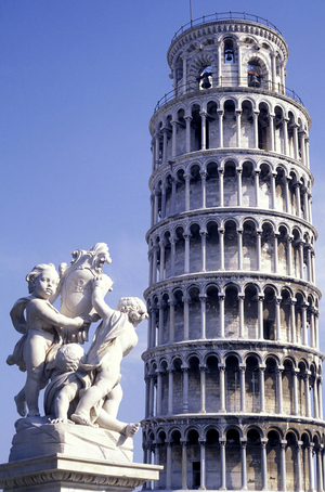 Statue in front of leaning tower, Pisa, Tuscany, Italy