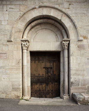The side door of the church of Saint Jacques (12th century) in Villefranche de Conflent - FRANCE. Occitanie. EASTERN PYRENEES. Villefranche-de-Conflent. Saint-Jacques Parish Church, 11th-13th v. Side door. Romanesque art. Architecture. Photography