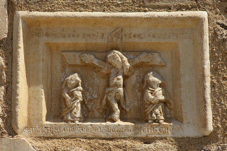 FRANCE. Occitanie. EASTERN PYRENEES. Saint Genis-des-Fontaines. Saint Genis Abbey. Monastery founded in 10th century. Sculptures in the western gate. Romanesque art. Photography. Relief on rock