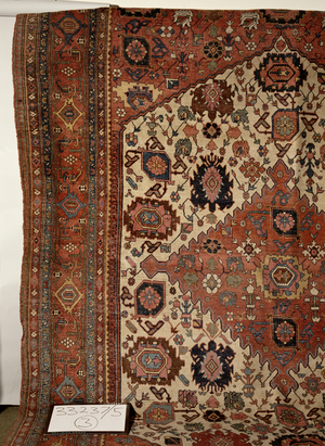North West Persian carpet with central medallion and design of flowers and angular scrolls (detail)
