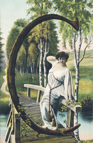 C: A woman in light clothing leaning on the parapet of a small wooden bridge, 1907 (postcard)