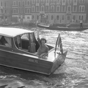 American actress Betsy Blair portrayed while waving from a water taxi crossing the Canal Grande, Venice, 1960 : Waving From A Water Taxi