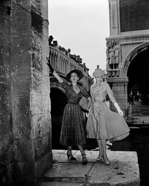 People on a bridge watching two women modelling Christian Dior outfits, Venice, 3rd June 1951 : Street Shooting