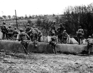 WWII:Near Wurzbach (Germany) March 20, 1945: During their advance, infantrymen of the 63rd DI of the VII US Army crossed the “Dragon's Teeth” of the Siegfried Line.