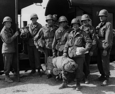 WWII:Near Reims (Marne) France 21 August 1945: At Camp Cleveland where American soldiers waiting to return to the United States or redeploy to the Pacific theatre of operations, these members of the 947th Quatermaster Company are planning to get on a train to start their journey back to the USA. They wear their registration number on their helmets.