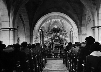 WWII:Domremy (Vosges) December 25, 1944: Members of the 1st Tactical Air Force attend the Midnight Mass with civilians in the church in the hometown of Joan of Arc.
