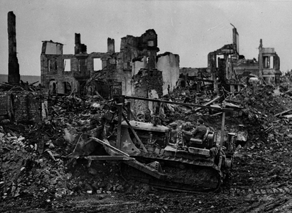 Second World War (1939-1945): St Vith (Belgium) at the end of January 1945: A bulldozer of a unit of the genie of the US Army clearing the streets of the city a few days after its liberation by soldiers of the 7th DB of the US Army