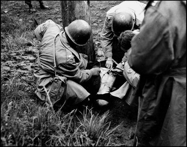 WWII:Kitzingen (Germany) April 23, 1945: Execution of a member of the Werwolf organization, type of Nazi subversive combat unit: on the Florian-Geyer stadium, former Volk-Grenadier Richard Jarczyk convinced of espionage, sabotage against American troops of the 7th US Army comes to be executed- US Army medical doctors find the deces