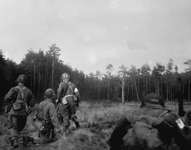 WWII:Near Wesel (Germany) March 24, 1945: On the east bank of the Rhine, American soldiers from a PIR (Parachute Infantry Regiment) of the 1st Armee Aeroportee Alliee search for enemy soldiers just after landing his glider