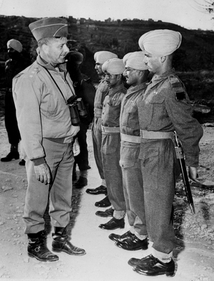 WWII:Italy April 26, 1944: American General Jacob Devers (Deputy Commander-in-Chief of Allied Troops in the Mediterranean Theatre of Operations) inspects a detachment of a Punjab regiment during an inspection tour on the front