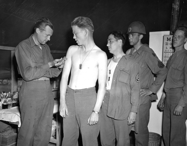 WWII:Near Mourmelon (Marne) France July 9, 1945: At Camp Pittsburg, in view of their redeployment to the Pacific Front, these soldiers from 110th RI of the 29th U.S. D.I are vaccinated.