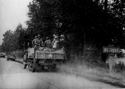 WWII:Franco-Belgian border on the RN50 (now D938) September 2, 1944: A column of half-tracks and vehicles of the 2nd DB US crosses the fountiere towards Rumes and Tournai (Belgium)