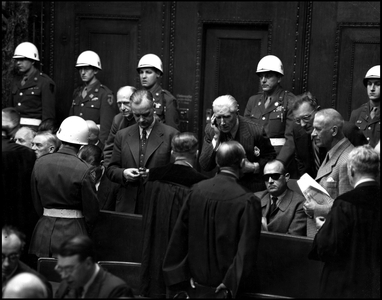 Second World War (1939-1945) - World War II (WWII or WW2): Nuremberg (Germany) March 2, 1946: During a suspension of the hearing of the International Tribunal (IMT) charged with trying the main Nazi officials- From left to right; Joachim Von Ribbentrop (1893-1946) (looking at his watch), Franz Von Papen (1879-1969), HFrank Years (1900-1946) (black glasses), Arthur Seyss-Inquart (1892-1946) and Wilhem Frick (1877-1946) met with their lawyers