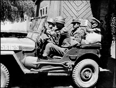WWII:Reinbach Prison (Germany) May 1945: Former Buchenwald Concentration Camp Commander Karl Hugo Burkhardt (centre) and Dr Waldemar Hoven (1903-1948) “Buchenwald Butcher”” leave prison in a jeep of the 506th Military Police of the 15th US Army