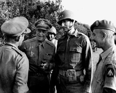 WWII:On the Salerno Front (Italy) September 20, 1943: During his visit to the troops of the Fifth Armee Alliee, General Dwight Eisenhower, Commander-in-Chief of the Allied Forces (centre) in conversation with British officers. On his left, American General Mark Clark (CG of the Fifth Armee Alliee)
