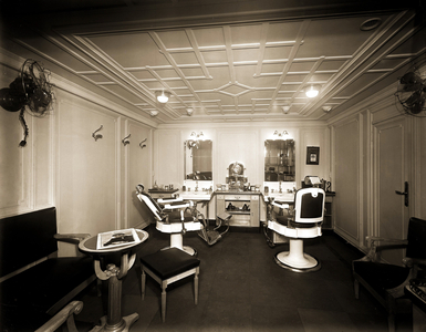 The men's barber on board the transatlantic liner Rex, 1930s (b/w photo)