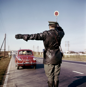 A police officer stopping a car, Milan, 1960’s (photo)