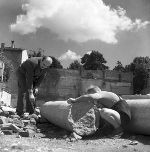 Lucio Fontana visiting the ruins of his atelier destroyed by bombs during the war, Milan, 1946 (b/w photo)