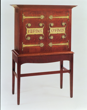 The 'Kelmscott Chaucer' cabinet, designed by C.F.A.Voysey (1857-1941) and made by F.Coote, 1899 (oak with brass fittings)
