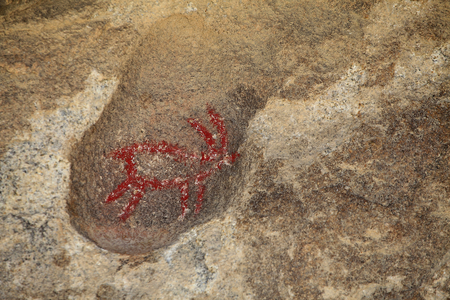 Indian Petroglyphs of North America. Painting added in the 50s for the shooting of a Western. Park National Joshua Tree, California, USA. North American Indian Culture
