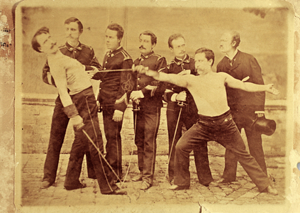 Group of young soldiers staging a duel, mimic expressions of circumstances - photograph circa 1900