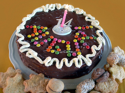 Birthday cake for a child of 14 years with the inscription “" Auguri "”. Italy.