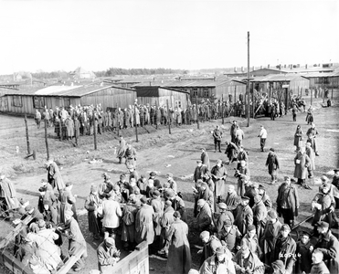 Liberated prisoners of Stalag 326, a POW camp holding 8,610 mostly Russian prisoners, after the arrival of US tank units, 22nd April 1945 (b/w photo)