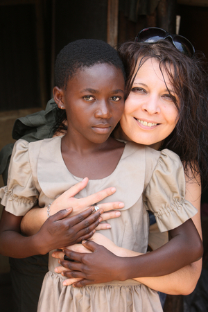 Sponsor and child in a primary school in Africa., Lome, Togo
