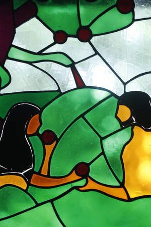 Kon Tum Cathedral. Stained glass window. Jesus, the Divine Mercy. Adam and Eve. The forbidden fruit. Kon Tum. Vietnam