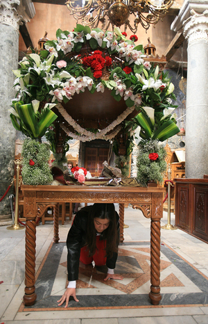Greek orthodox devotee under the epitaphios on Good friday Thessalonique Grece