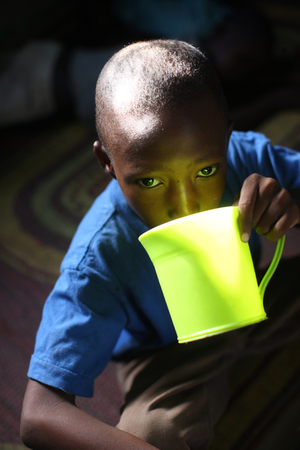 African boy drinking. Bamako Mali