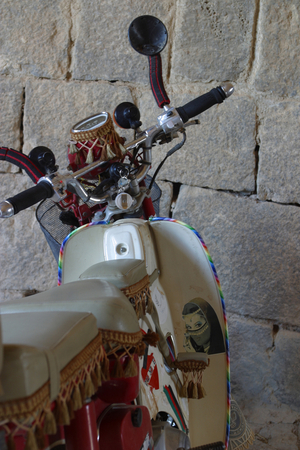 Motorcycle with a sticker of a veiled Arab girl, Syria.