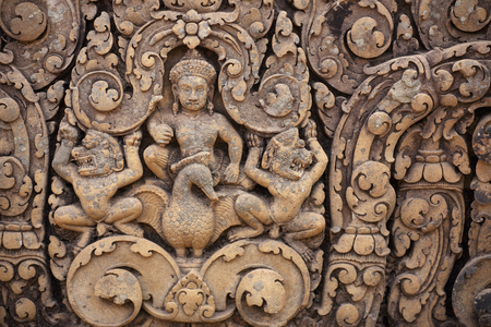 Carved pink stone pediment, Banteay Srei Hindu temple, Angkor site, Cambodia (photo)