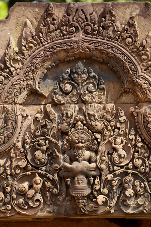 Carved pink stone pediment, Banteay Srei Hindu temple, Angkor site, Cambodia (photo)