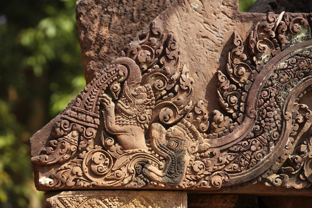 Carved pink stone pediment, Banteay Srei Hindu temple, Angkor site, Cambodia (photo)