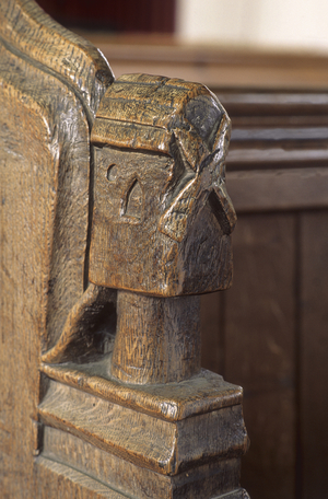 Windmill bench end (carved wood)