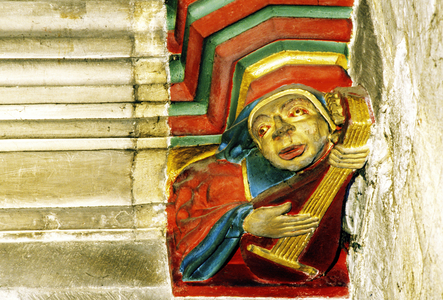 Musician playing the lute (painted carved stone)