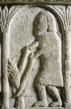 Weeding, detail from the Norman font depicting the labour of the month for June (carved stone)