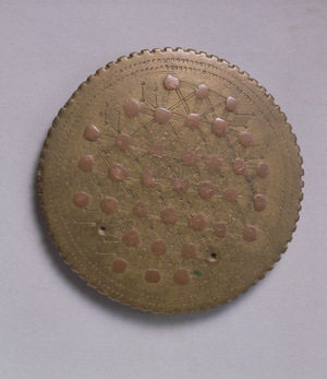 Lens-shaped weight with copper inserts (brass)